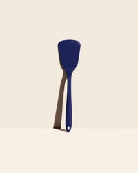 The GIR Ultimate Turner in Navy on a cream background. 