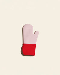A Red Oven Mitt on a cream background. 