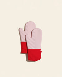 The Red Oven Mitts on a cream background. 