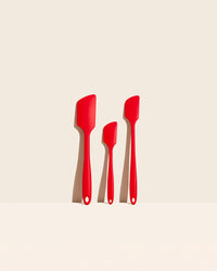 The GIR Red 3 Piece Spatula Set on a cream background. 