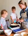Mom and her 2 little boys seen using the GIR 8 Piece Mini Bundle whilst baking. 